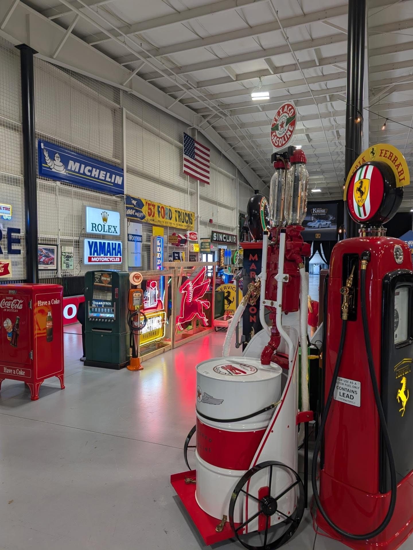 Restored vintage gas pumps and neon signage in the memorabilia display