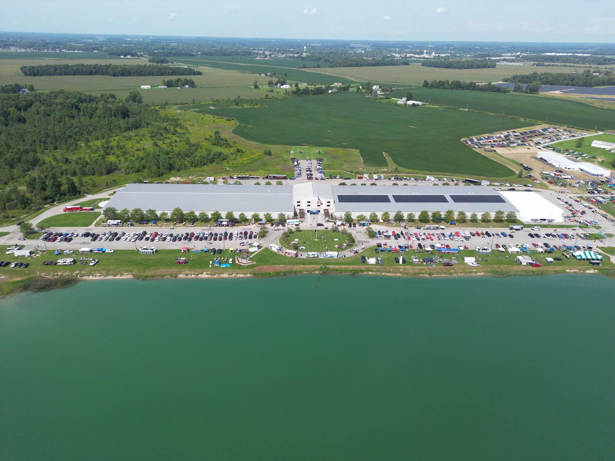 Aerial view of the Auburn Classic Cars facility during a collector car event